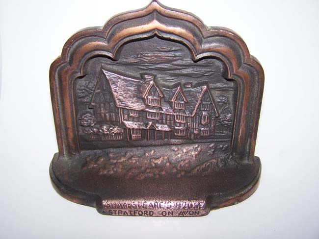 A pair of cast iron Antique Bookends depicting Shakespeare's birthplace in Stratford-on-Avon
